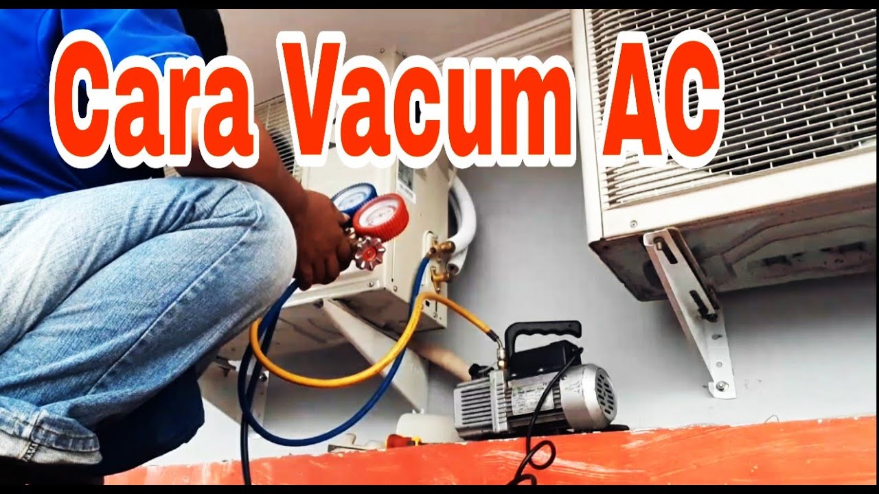 Teknisi melakukan vakum AC truk